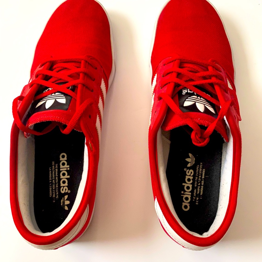 Adidas red with white stripe shoes